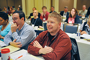 group of individuals seated at a graduate residency