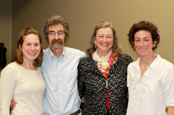 Peggy Lynn, standing center right and seen with her daughter Winter Eyres and husband Dan Duggan at left, and daughter Willow Eyres at right, and her family enjoy the Altes Prize celebration at the center open house. (Photo/Tracy Zappola)