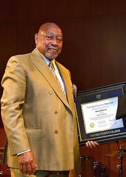 Kenny Barron ’78 holds his Honorary Doctorate of Music. The degree is conferred by the SUNY Board of Trustees.
