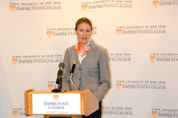 SUNY Empire State College President Merodie A. Hancock greets guests and partners from NYSERDA, National Grid and ChargePoint at the unveiling of the ChargePoint EV charging station at 113 West Ave., the college’s LEED Silver-certified building.