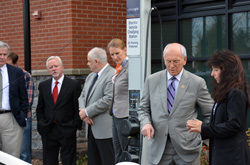 Rep. Paul D. Tonko, D-NY, talks with Jackie St. Onge of Ballston Lake as St. Onge recharges her EV. St. Onge, who retired from the Burnt Hills-Ballston Lake School District as assistant superintendent, explains how her car works and why she decided to purchase and EV.