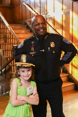 Brianna Collichio, who sang the National Anthem, and RPD Chief James Sheppard '99, at the annual Genesee Valley Center Community Event. Sheppard was recognized for his leadership and community service.