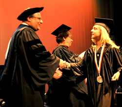 SUNY Trustee Joseph Belluck congratulates student speaker Amy Alio ’13.