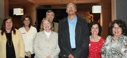 Faculty members Christine Leake, far left, Linda Treinish, Stacey Gallagher and Thomas Brady, assessment specialist, join Walter Dean Myers ‘84, wearing glasses, and faculty members Jennifer Spitz and Arlene Rider after Dean’s lecture at the college’s Hartsdale office.