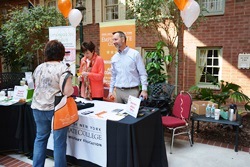 A student visits with Susan Bruce and Chuck Van Vorst from the college's Office of Veteran and Military Education at the 2014 Student Wellness Retreat