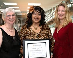 Deborah Gregory '86, recipient of the Distinguished Alumni Award (center) is flanked by Dean Cynthia Ward of the college's New York City location and President Merodie A. Hancock.