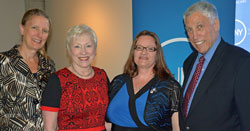 Lori Mould, second from right, the first student to serve on the SUNY Board of Trustees, was joined at the swearing in ceremony by President Hancock, far left, Chancellor Zimpher and immediate past president of Genesee Community College, Stuart Steiner.