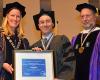 Professor Ian Reifowitz stands between President Merodie A. Hancock and Dean Michael A. Spitzer at the college’s 2014 Long Island commencement exercise. Reifowitz was presented with a medallion and framed certificate in recognition of being named a 2014 recipient of the SUNY Chancellor’s Award for Excellence in Scholarship and Creative Activities.