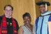 Theresa Carter (center) is flanked by Deborah Amory, acting provost for academic affairs and Dean Gary Lacy, during the 2014 Commencement Exercises in Harsdale.