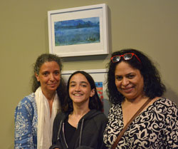 Student Anita Sillery, at left, stands under “Untitled-A” with her daughter Isabella, 14, and fellow student-artist Claudia Rocha-Van Holt, who traveled to Albany with the Sillerys. Photo/Empire State College