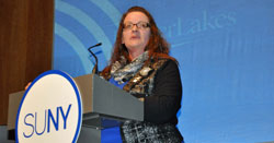 Lori Mould '14 introduces Chancellor Zimpher at the 2015 State University Address.