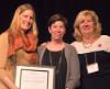 Susan McFadden poses with Merodie Hancock, excellence award