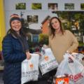 SUNY Empire employee Janet Aiello-Cerio, at left, drops off holiday gifts to Lindsay Duma, a volunteer with the Franklin Community Center.