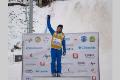 Two-time Olympian and alumna Ashley Caldwell '14 raises the FIS World Cup. Caldwell is the 2016 world champion in freestyle skiing, women's aerials. Photo/ USSA/Gary Heuer