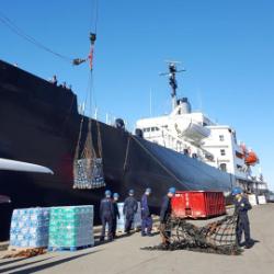 SUNY Maritime's training vessel, the Empire State VI, being loaded with relief supplies prior to embarking to the Gulf Coast.