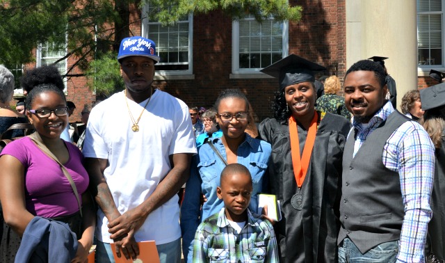 Graduate and student speaker Tirzah Hall's family surrounds her right after the 2017 Buffalo commencement.