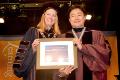 President Hancock presents Sewon Kim with the Chancellor's Award for Excellence in Creative Activities. Photo/Empire State College