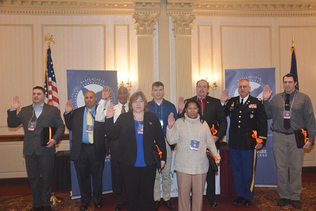 Nine members of the inaugural SALUTE class, from left, Andrew Smith, Raul Rodriguez, Juan Nicholson, Teri Tompkins, Nicholas Lee, Elissa Greene, Brandon Dearborn, Douglas Sherman and Bryant Smith, took the induction oath.