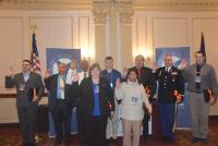 Nine members of the inaugural SALUTE class, from left, Andrew Smith, Raul Rodriguez, Juan Nicholson, Teri Tompkins, Nicholas Lee, Elissa Greene, Brandon Dearborn, Douglas Sherman and Bryant Smith, took the induction oath.