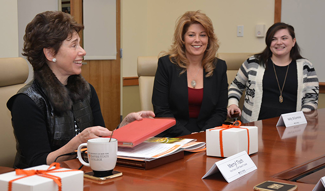 Merryl Tisch, member of the SUNY Board of Trustees, at left, meets with SUNY Empire students Kelly DiCarmine and Allie Quinn.